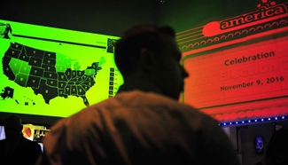 People watch live broadcast of ballot counting of U.S. presidential election