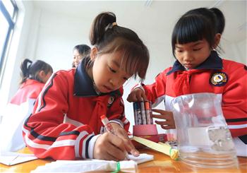 New campus of landslide-hit primary school put into use in S China
