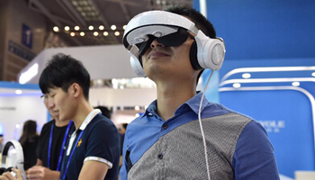 Audience experience VR games at China Hi-Tech Fair in Shenzhen