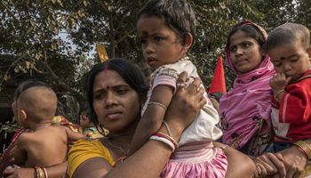 Indian mothers participate in protest demanding maternity benefit