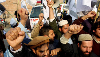 Pakistani people protest against cross border firing in NW Pakistan