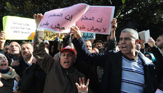 People attend protest against law on pensions in Algiers
