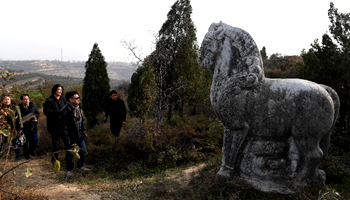 Tourists view stone sculptures at Jianling Mausoleum in NW China