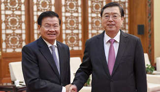 Zhang Dejiang meets with Lao PM in Beijing