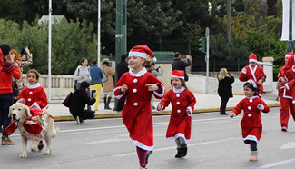Runners in Santa Claus costumes participate in fun 2.5-kilometer race in Greece