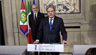 Italian president asks outgoing FM to form new gov't