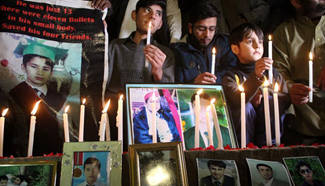 People mourn for victims in Peshawar school attack in Pakistan