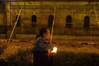 Egyptians attend candle vigil to mourn victims of suicide bomb attack