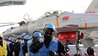 Chinese Navy holds live ammunition drill for aircraft carrier formation