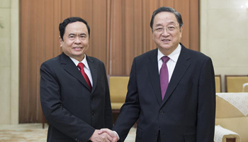Top political advisor calls for deepened exchanges with Vietnam Fatherland Front