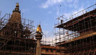 People work at reconstruction site of damaged temples in Lalitpur, Nepal
