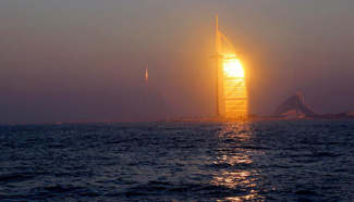 Arabian tower seen during sunset in Dubai