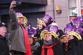 People gather at Times Square to welcome 2017