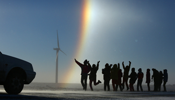 People enjoy rainbow along national highway in China's Inner Mongolia