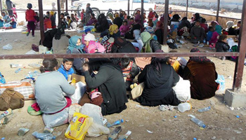 Displaced people gather at Khaled office, Iraq