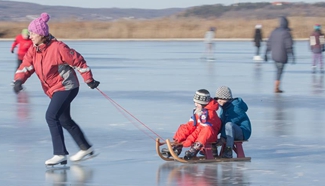People have fun on frozen Lake Velence in Agard, Hungary