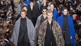 Models present creations by Issey Miyake in Paris