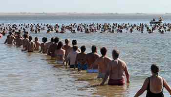 Some 2,000 people bathe in Epecuen Lake to beat Guinness Record