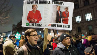 People rally against Trump's refugee entry ban in London