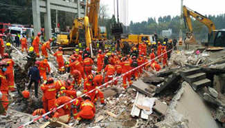 China homes collapse, nine buried