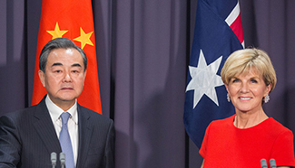 Chinese FM urges global free trade boost on Melbourne visit