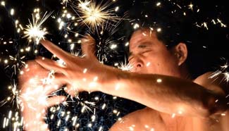 "Firework eating" performed during Lantern Festival in SE China