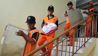 Staff members carry ballot boxes in Jakarta, Indonesia