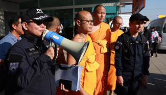 Members of Thailand's DSI search for Phra Dhammajayo at Wat Dhammakaya temple