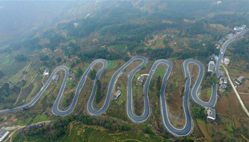 Winding road looks like jade belt around mountain in central China