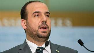 Syria's opposition delegation leader addresses media in Geneva