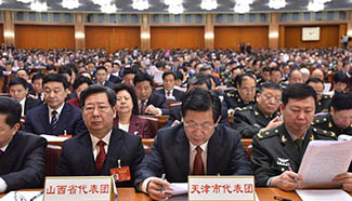 Deputies attend opening meeting of 5th session of 12th NPC