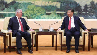 President Xi meets U.S. Secretary of State