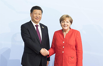 President Xi Jinping shakes hands with Chancellor Angela Merkel in Hamburg, Germany