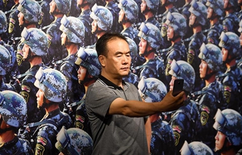 Photo exhibition marking 90th anniversary of PLA held in Beijing