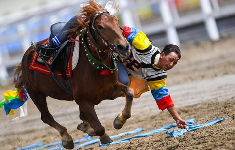 Horse riders perform during Shoton Festival in Lhasa