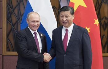 Chinese President Xi meets Russian President Putin on sidelines of meeting
