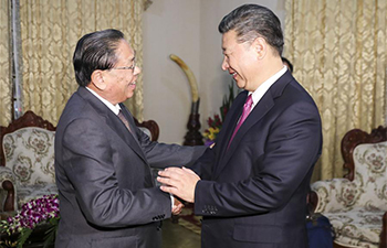 Xi meets former Lao president