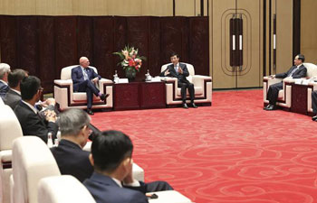 Wang Huning meets guests of Fourth World Internet Conference