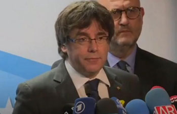 Ousted Catalan leader ready to meet PM outside Spain