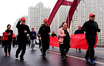 Fitness run held across China to greet upcoming New Year
