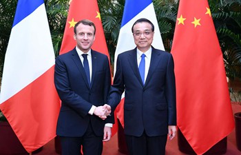 Chinese premier meets visiting French president in Beijing