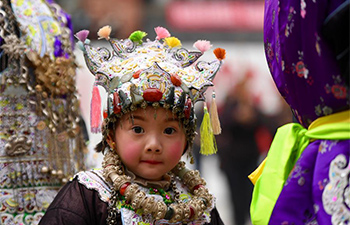 Children attend Dong New year festival with ethnic hats in SW China