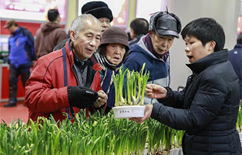 People purchase goods for upcoming Spring Festival in Shanghai