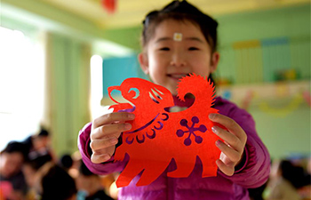 Children learn paper-cutting to greet upcoming Chinese lunar New Year in N China