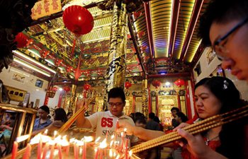People pray on first day of Chinese Lunar New Year in Yangon, Myanmar