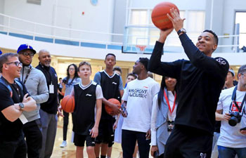 NBA star C.J. McCollum interacts with children in LA