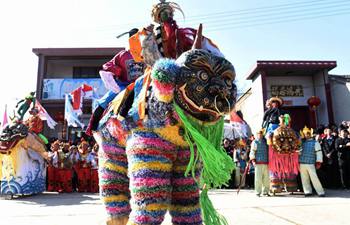 Folk artists on stilts perform during Chinese New Year holiday in N China's Shanxi