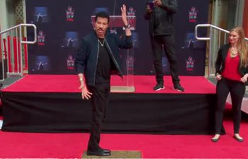 American singer Lionel Richie was honored with hand and footprints in Hollywood
