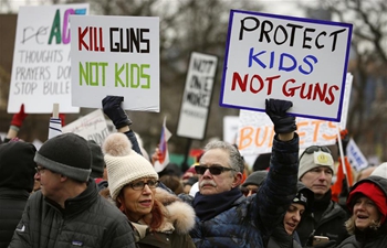 People take part in "March for Our Lives" gun control rally in Chicago