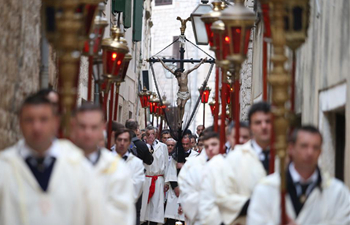 People take part in Procession Za Krizen ahead of Easter in Croatia